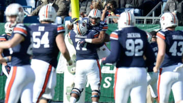 Auburn football wide receiver Darius Slayton (81) celebrates his first touchdown with offensive lineman Marquel Harrell (77) in the first quarter of the Music City Bowl NCAA college football game Friday, Dec. 28, 2018, at Nissan Stadium in Nashville, Tenn.