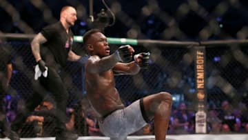 MELBOURNE, AUSTRALIA - OCTOBER 06: Israel Adesanya celebrates his victory over Robert Whittaker between in their Middleweight title bout during UFC 243 at Marvel Stadium on October 06, 2019 in Melbourne, Australia. (Photo by Darrian Traynor/Getty Images)