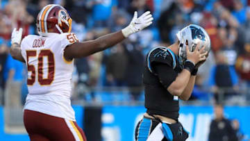 CHARLOTTE, NORTH CAROLINA - DECEMBER 01: Kyle Allen #7 of the Carolina Panthers reacts after his last play on offense as Chris Odom #50 of the Washington Redskins watches on during their game at Bank of America Stadium on December 01, 2019 in Charlotte, North Carolina. (Photo by Streeter Lecka/Getty Images)