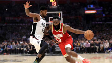 LOS ANGELES, CALIFORNIA - NOVEMBER 22: James Harden #13 of the Houston Rockets dribbles past Paul George #13 of the Los Angeles Clippers during the first half of a game at Staples Center on November 22, 2019 in Los Angeles, California. NOTE TO USER: User expressly acknowledges and agrees that, by downloading and/or using this photograph, user is consenting to the terms and conditions of the Getty Images License Agreement (Photo by Sean M. Haffey/Getty Images)