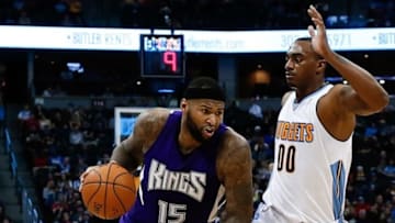 Feb 23, 2016; Denver, CO, USA; Sacramento Kings center DeMarcus Cousins (15) drives to the net against Denver Nuggets forward Darrell Arthur (00) in the fourth quarter at Pepsi Center. The Kings defeated the Nuggets 114-110. Mandatory Credit: Isaiah J. Downing-USA TODAY Sports