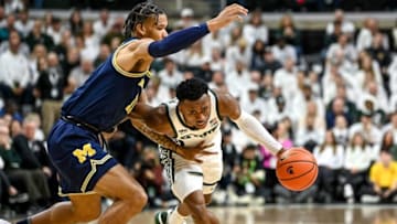 Michigan State's Tyson Walker, right, moves around Michigan's Isaiah Barnes during the first half on Saturday, Jan. 7, 2023, at the Breslin Center in East Lansing.230107 Msu Mich Bball 096a