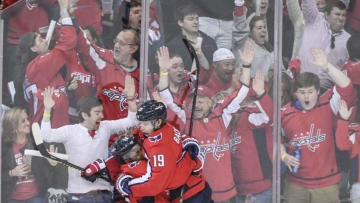 WASHINGTON, DC - APRIL 20: Washington Capitals center Nicklas Backstrom (19) celebrates his second goal of the game with Devante Smith-Pelly (25) in the second period against the Carolina Hurricanes during first round playoff action at Capital One Arena. (Photo by Jonathan Newton / The Washington Post via Getty Images)