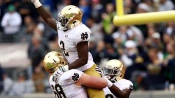 EAST RUTHERFORD, NJ - OCTOBER 01: Dexter Williams #2 of the Notre Dame Fighting Irish celebrates his touchdown with teammates Mike McGlinchey #68 and Torii Hunter Jr. #16 in the second half against the Syracuse Orange at MetLife Stadium on October 1, 2016 in East Rutherford, New Jersey.The Notre Dame Fighting Irish defeated the Syracuse Orange 50-33. (Photo by Elsa/Getty Images)