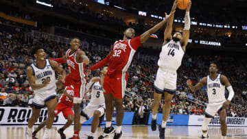 PITTSBURGH, PENNSYLVANIA - MARCH 20: Caleb Daniels #14 of the Villanova Wildcats catches the rebound as E.J. Liddell #32 of the Ohio State Buckeyes defends in the second half of the game during the second round of the 2022 NCAA Men's Basketball Tournament at PPG PAINTS Arena on March 20, 2022 in Pittsburgh, Pennsylvania. (Photo by Kirk Irwin/Getty Images)