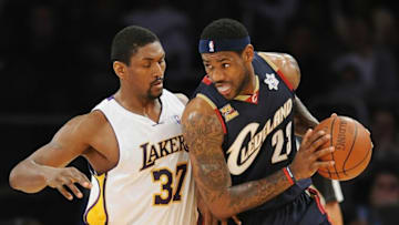 LOS ANGELES, CA - DECEMBER 25: LeBron James #23 of the Cleveland Cavaliers drives against Ron Artest #37 of the Los Angeles Lakers at Staples Center on December 25, 2009 in Los Angeles, California. NOTE TO USER: User expressly acknowledges and agrees that, by downloading and or using this photograph, User is consenting to the terms and conditions of the Getty Images License Agreement. (Photo by Lisa Blumenfeld/Getty Images)