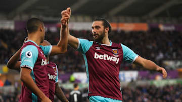 SWANSEA, WALES - DECEMBER 26: Winston Reid (L) of West Ham United is congratulated by Andy Carroll after scoring his team's second goal with a header during the Premier League match between Swansea City and West Ham United at Liberty Stadium on December 26, 2016 in Swansea, Wales. (Photo by Stu Forster/Getty Images)