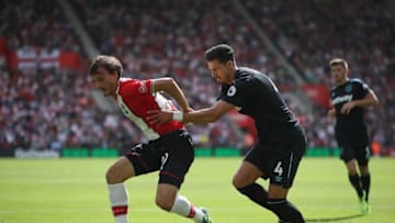 SOUTHAMPTON, ENGLAND - AUGUST 19: Manolo Gabbiadini of Southampton and Jose Fonte of West Ham United during the Premier League match between Southampton and West Ham United at St Mary's Stadium on August 19, 2017 in Southampton, England. (Photo by Julian Finney/Getty Images)