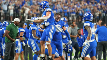 Sep 4, 2021; Paradise, Nevada, USA; Brigham Young Cougars linebacker Ben Bywater (33) celebrates with Brigham Young Cougars linebacker Drew Jensen (46) after a missed field goal attempt by the Arizona Wildcats at Allegiant Stadium. Mandatory Credit: Stephen R. Sylvanie-USA TODAY Sports