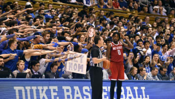 DURHAM, NORTH CAROLINA - MARCH 02: The Cameron Crazies taunt DJ Funderburk #0 of the North Carolina State Wolfpack during the second half of their game against the Duke Blue Devils at Cameron Indoor Stadium on March 02, 2020 in Durham, North Carolina. Duke won 88-69. (Photo by Grant Halverson/Getty Images)