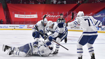 MONTREAL, QC - MAY 29: TJ Brodie #78 of the Toronto Maple Leafs celebrates his goal with teammates Zach Hyman #11, Zach Bogosian #22, Pierre Engvall #47 and Nick Foligno #71 against the Montreal Canadiens during the third period in Game Six of the First Round of the 2021 Stanley Cup Playoffs at the Bell Centre on May 29, 2021 in Montreal, Canada. The Montreal Canadiens are the first NHL Canadian team to host 2,500 fans since the COVID-19 pandemic. (Photo by Minas Panagiotakis/Getty Images)