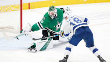 DALLAS, TEXAS - MARCH 25: Jake Oettinger #29 of the Dallas Stars blocks a shot on goal against Ondrej Palat #18 of the Tampa Bay Lightning in the second period at American Airlines Center on March 25, 2021 in Dallas, Texas. (Photo by Tom Pennington/Getty Images)