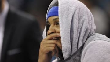 Jan 23, 2016; Charlotte, NC, USA; New York Knicks forward Carmelo Anthony (7) reacts from the bench during the second half against the Charlotte Hornets at Time Warner Cable Arena. The Hornets won 97-84. Mandatory Credit: Sam Sharpe-USA TODAY Sports