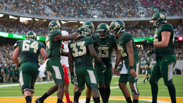 WACO, TX - SEPTEMBER 2: Jamychal Hasty #33 of the Baylor Bears celebrates with teammates after a 13 yard touchdown run against the Liberty Flames during the first half at McLane Stadium on September 2, 2017 in Waco, Texas. (Photo by Cooper Neill/Getty Images)