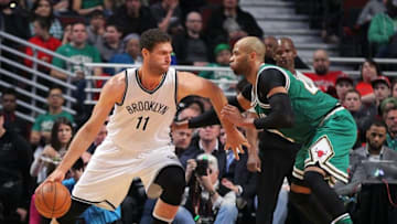 Mar 17, 2016; Chicago, IL, USA; Brooklyn Nets center Brook Lopez (11) is defended by Chicago Bulls forward Taj Gibson (22) during the second half at the United Center. Chicago won 118-102. Mandatory Credit: Dennis Wierzbicki-USA TODAY Sports