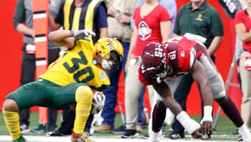 SAN ANTONIO, TX - MARCH 31: Justin Stockton #30 of the Arizona Hotshots tries to avoid the tackle of Darnell Leslie #51 of the San Antonio Commanders at Alamodome on March 31, 2019 in San Antonio, Texas. (Photo by Ronald Cortes//Getty Images)