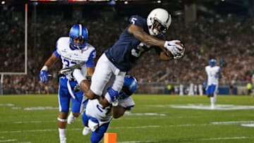STATE COLLEGE, PA - SEPTEMBER 16: DaeSean Hamilton #5 of the Penn State Nittany Lions dives for the end-zone scoring a 27 yard touchdown in the first half against Antreal Allen #21 and Victor Heyward #37 of the Georgia State Panthers at Beaver Stadium on September 16, 2017 in State College, Pennsylvania. (Photo by Justin K. Aller/Getty Images)