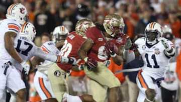 Jan 6, 2014; Pasadena, CA, USA; Florida State Seminoles tailback Devonta Freeman (8) runs with the ball against the Auburn Tigers for the 2014 BCS National Championship game at the Rose Bowl. Mandatory Credit: Matthew Emmons-USA TODAY Sports