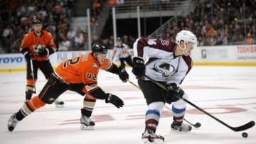 October 16, 2015; Anaheim, CA, USA; Colorado Avalanche right wing Mikko Rantanen (96) moves the puck ahead of Anaheim Ducks defenseman Josh Manson (42) during the third period at Honda Center. Mandatory Credit: Gary A. Vasquez-USA TODAY Sports