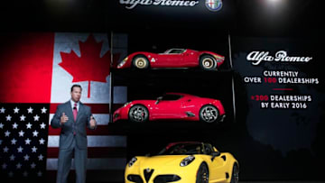 DETROIT, MI - JANUARY 12: Reid Bigland, President and CEO of Alfa Romeo North America, reveals the new Alfa Romeo 4C Spider convertible to the media at the 2015 North American International Auto Show on January 12, 2015 in Detroit, Michigan. More than 5000 journalists from around the word will see approximately 45 new vehicles unveiled. The 2015 NAIAS opens to the public January 17th and concludes January 25th. (Photo by Bill Pugliano/Getty Images)