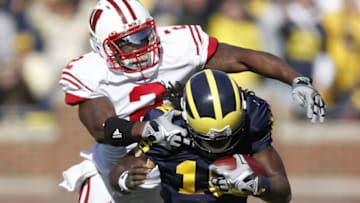 ANN ARBOR, MI - NOVEMBER 20: Jay Valai #2 of the Wisconsin Badgers tackles Denard Robinson #16 of the Michigan Wolverines at Michigan Stadium on November 20, 2010 in Ann Arbor, Michigan. (Photo by Gregory Shamus/Getty Images)