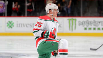 NEWARK, NEW JERSEY - JANUARY 07: Mirco Mueller #25 of the New Jersey Devils stretches during warm ups before the game against the New York Islanders at Prudential Center on January 07, 2020 in Newark, New Jersey. (Photo by Elsa/Getty Images)