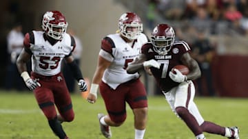 COLLEGE STATION, TX - OCTOBER 29: Keith Ford #7 of the Texas A&M Aggies rushes past Rodney Butler #53 of the New Mexico State Aggies and Roy Lopez #51 in the second quarter at Kyle Field on October 29, 2016 in College Station, Texas. (Photo by Bob Levey/Getty Images)