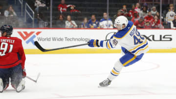 Sep 25, 2022; Washington, District of Columbia, USA; Buffalo Sabres center Tyson Kozak (48) shoots the puck to score a goal past Washington Capitals center Joe Snively (91) during the second period at Capital One Arena. Mandatory Credit: Amber Searls-USA TODAY Sports
