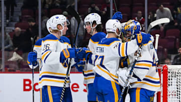 Nov 22, 2022; Montreal, Quebec, CAN; Buffalo Sabres players gather around Buffalo Sabres goalie Craig Anderson (41) to celebrate the win against the Montreal Canadiens during the third period at Bell Centre. Mandatory Credit: David Kirouac-USA TODAY Sports
