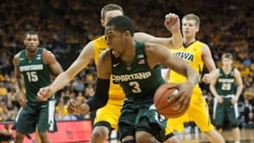 Dec 29, 2015; Iowa City, IA, USA; Michigan State Spartans guard Alvin Ellis III (3) dribbles the ball around Iowa Hawkeyes forward Nicholas Baer (51) during the second half at Carver-Hawkeye Arena. The Hawkeyes won 83-70. Mandatory Credit: Jeffrey Becker-USA TODAY Sports