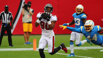 Oct 4, 2020; Tampa, Florida, USA; Tampa Bay Buccaneers tight end O.J. Howard (80) catches a touchdown pass over Los Angeles Chargers outside linebacker Kyzir White (44) in the third quarter of a NFL game at Raymond James Stadium. Mandatory Credit: Kim Klement-USA TODAY Sports