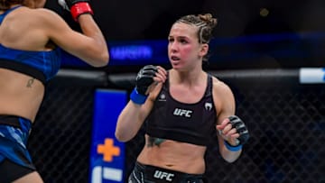 Jan 22, 2022; Anaheim, California, USA; Silvana Gomez Juarez (red gloves) competes against Vanessa Demopoulos (blue gloves) during UFC 270 at Honda Center. Mandatory Credit: Gary A. Vasquez-USA TODAY Sports