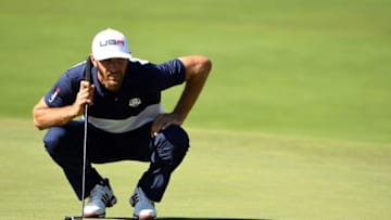 Oct 2, 2016; Chaska, MN, USA; Dustin Johnson of the United States lines up a putt on the first green during the single matches in 41st Ryder Cup Hazeltine National Golf Club. Mandatory Credit: John David Mercer-USA TODAY Sports