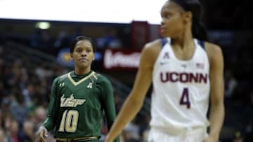 Feb 29, 2016; Storrs, CT, USA; South Florida Bulls guard Courtney Williams (10) on the court with Connecticut Huskies guard Moriah Jefferson (4) in the second half at Gampel Pavilion. UConn defeated South Florida 79-59. Mandatory Credit: David Butler II-USA TODAY Sports