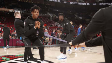 PORTLAND, OR - NOVEMBER 28: Wesley Iwundu #25 of the Orlando Magic stretches prior to the game against the Portland Trail Blazers on November 28, 2018 at the Moda Center Arena in Portland, Oregon. NOTE TO USER: User expressly acknowledges and agrees that, by downloading and or using this photograph, user is consenting to the terms and conditions of the Getty Images License Agreement. Mandatory Copyright Notice: Copyright 2018 NBAE (Photo by Cameron Browne/NBAE via Getty Images)