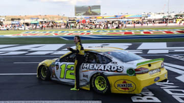 CHARLOTTE, NC - SEPTEMBER 30: Ryan Blaney, driver of the #12 Menards/Pennzoil Ford, celebrates after winning the Monster Energy NASCAR Cup Series Bank of America Roval 400 at Charlotte Motor Speedway on September 30, 2018 in Charlotte, North Carolina. (Photo by Streeter Lecka/Getty Images)