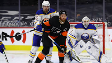 Apr 11, 2021; Philadelphia, Pennsylvania, USA;Buffalo Sabres defenceman Rasmus Ristolainen (55) hits Philadelphia Flyers center Sean Couturier (14) in the second period at Wells Fargo Center. Mandatory Credit: Kyle Ross-USA TODAY Sports