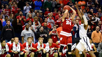 Mar 20, 2016; St. Louis, MO, USA; Wisconsin Badgers guard Bronson Koenig (24) shoots the game-winning shot over Xavier Musketeers guard Remy Abell (10) during the second half of the second round in the 2016 NCAA Tournament at Scottrade Center. Wisconsin won 66-63. Mandatory Credit: Jeff Curry-USA TODAY Sports