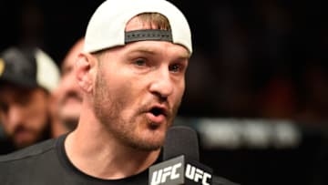 DALLAS, TX - MAY 13: Stipe Miocic speaks to Joe Rogan after his TKO victory over Junior Dos Santos in their UFC heavyweight championship fight during the UFC 211 event at the American Airlines Center on May 13, 2017 in Dallas, Texas. (Photo by Josh Hedges/Zuffa LLC/Zuffa LLC via Getty Images)