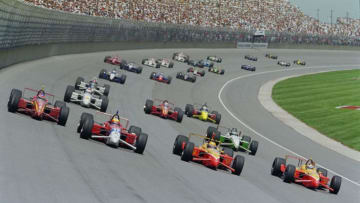 Jimmy Vasser of the United States driving the #12 Target Chip Ganassi Racing Reynard 97i Honda races alongside Mauricio Gugelmin in the #17 PacWest Hollywood Reynard 97i Mercedes and the two Patrick Racing Brahma Reynard 97i's of #20 Scott Pruett and #40 Raul Boesel at the startof the Championship Auto Racing Teams (CART) 1997 PPG CART World Series U.S. 500 race on 27 July 1997 at Michigan International Speedway, Brooklyn, Michigan, United States. (Photo by David Taylor/Allsport/Getty Images)