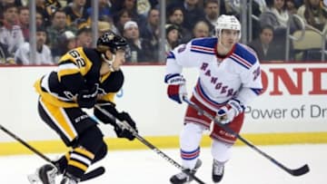 Feb 10, 2016; Pittsburgh, PA, USA; Pittsburgh Penguins left wing Carl Hagelin (62) sktes with the puck against New York Rangers left wing Chris Kreider (20) during the first period at the CONSOL Energy Center. Mandatory Credit: Charles LeClaire-USA TODAY Sports