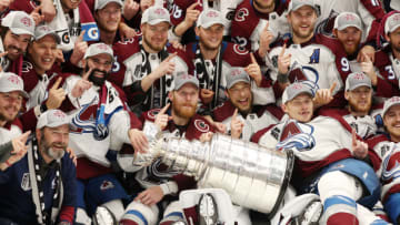 TAMPA, FLORIDA - JUNE 26: Colorado Avalanche coaches and players pose for a photo after defeating the Tampa Bay Lightning 2-1 in Game Six of the 2022 NHL Stanley Cup Final at Amalie Arena on June 26, 2022 in Tampa, Florida. (Photo by Christian Petersen/Getty Images)