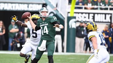 Oct 29, 2016; East Lansing, MI, USA; Michigan State Spartans quarterback Brian Lewerke (14) attempts a pass as Michigan Wolverines linebacker Jabrill Peppers (5) defends during the second half at Spartan Stadium. Mandatory Credit: Brad Mills-USA TODAY Sports