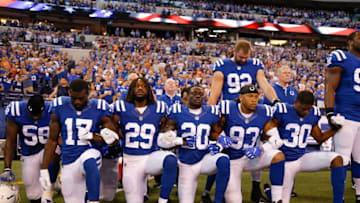 INDIANAPOLIS, IN - SEPTEMBER 24: Members of the Indianapolis Colts stand and kneel for the national anthem prior to the start of the game between the Indianapolis Colts and the Cleveland Browns at Lucas Oil Stadium on September 24, 2017 in Indianapolis, Indiana. (Photo by Michael Reaves/Getty Images)