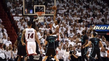 May 1, 2016; Miami, FL, USA; Miami Heat center Hassan Whiteside (21) dunks the ball as Charlotte Hornets center Frank Kaminsky III (44) looks on during the first half in game seven of the first round of the NBA Playoffs at American Airlines Arena. Mandatory Credit: Steve Mitchell-USA TODAY Sports