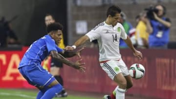Jul 1, 2015; Houston, TX, USA; Mexico forward Javier Hernandez (14) plays the ball as Honduras defender Henry Figueroa (5) defends during the first half at NRG Stadium. Mexico and Honduras played to a 0-0 tie. Mandatory Credit: Troy Taormina-USA TODAY Sports