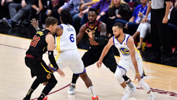 CLEVELAND, OH - JUNE 06: Stephen Curry #30 of the Golden State Warriors dribbles with the ball defended by Kyle Korver #26 and Jeff Green #32 of the Cleveland Cavaliers in the first half during Game Three of the 2018 NBA Finals at Quicken Loans Arena on June 6, 2018 in Cleveland, Ohio. NOTE TO USER: User expressly acknowledges and agrees that, by downloading and or using this photograph, User is consenting to the terms and conditions of the Getty Images License Agreement. (Photo by Jamie Sabau/Getty Images)