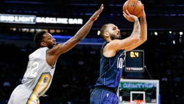 ORLANDO, FL - FEBRUARY 6: Evan Fournier #10 of the Orlando Magic shoots a jumper while Jeff Green #32 of the Cleveland Cavaliers trys to block it from behind during the game at the Amway Cetnter on February 6, 2018 in Orlando, Florida. The Magic defeated the Cavaliers 116 to 98. NOTE TO USER: User expressly acknowledges and agrees that, by downloading and or using this photograph, User is consenting to the terms and conditions of the Getty Images License Agreement. (Photo by Don Juan Moore/Getty Images)