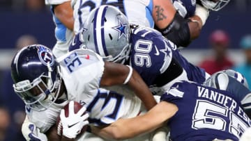 ARLINGTON, TX - NOVEMBER 05: Dion Lewis #33 of the Tennessee Titans gets tackled by Demarcus Lawrence #90 of the Dallas Cowboys and Leighton Vander Esch #55 of the Dallas Cowboys in the first half of a football game at AT&T Stadium on November 5, 2018 in Arlington, Texas. (Photo by Tom Pennington/Getty Images)