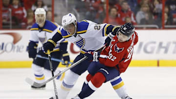 Feb 1, 2015; Washington, DC, USA; St. Louis Blues left wing Alexander Steen (20) and Washington Capitals center Evgeny Kuznetsov (92) battle for the puck in the second period at Verizon Center. Mandatory Credit: Geoff Burke-USA TODAY Sports
